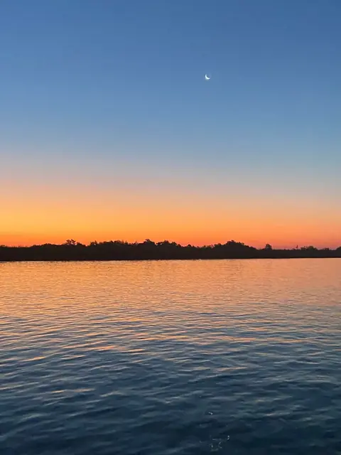 Dawn over calm water in the Venice, Louisiana delta